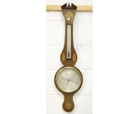 A George III mahogany wheel barometer with alcohol thermometer and silvered dials, inscribed 'Stampa &amp; Co N25 Kirby Stt..