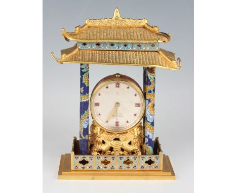 A 20th century Chinese gilt metal and cloisonné cased mantel alarm clock with eight day movement, the case modelled as a pavi