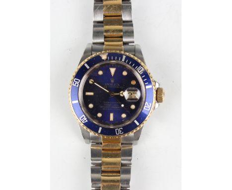 A Rolex Oyster Perpetual Date Submariner stainless steel and yellow gold gentleman's bracelet wristwatch, circa 1989, Ref. No