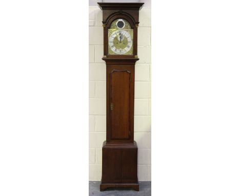 A George III oak longcase clock with eight day movement striking on a bell, the 12-inch brass breakarch dial with silvered bo