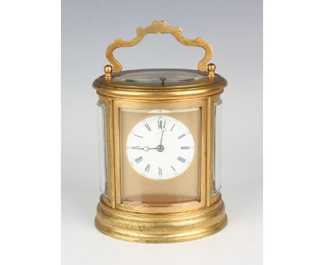 A late 19th century French lacquered brass oval cased carriage clock by Drocourt, with eight day movement striking hours and 