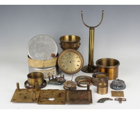 A collection of various ship's chronometer parts, including a Thomas Mercer dial and brass bowl, other brass bowls and moveme
