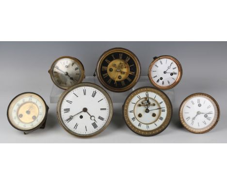 A collection of mantel clock movements and dials, including various late 19th century French eight day bell strike movements.