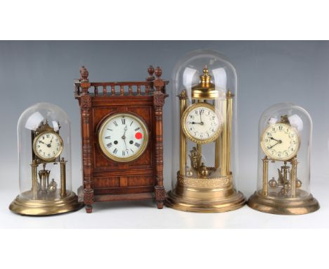 A 20th century brass anniversary mantel timepiece, the cream dial with Arabic hour numerals, on a circular base with glass do