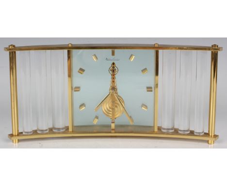 A Jaeger-LeCoultre gilt brass and lucite mantel timepiece with visible eight day gilt jewelled movement, the signed glass fro