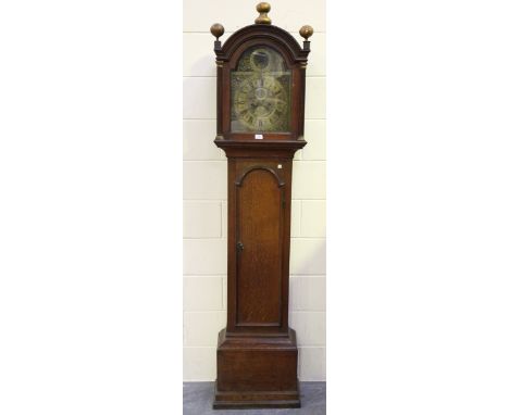 A mid-18th century oak longcase clock with eight day movement striking on a bell, the 12-inch brass breakarch dial with moonp