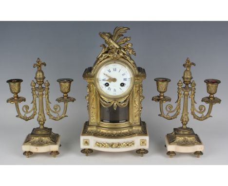 A late 19th century French brass and alabaster mantel clock garniture, the clock with eight day movement striking on a bell v