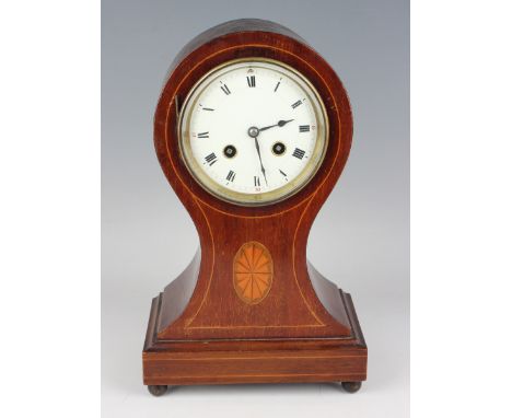 An Edwardian mahogany balloon cased mantel clock with eight day movement striking on a gong, the backplate with Richard &amp;