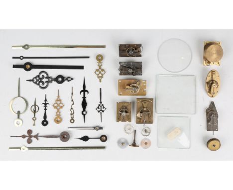 A collection of clock and watch parts, including various platform escapements and parts, hands and watch glasses.Buyer’s Prem