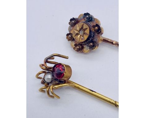 A 9ct gold stick/tie pin in the form of a spider along with a 15ct tie pin gold set with a diamond