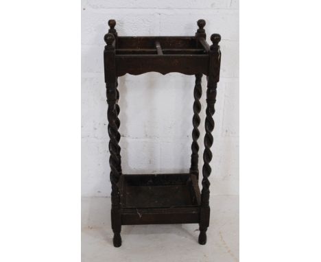 A Victorian oak stick stand, with barley-twist supports