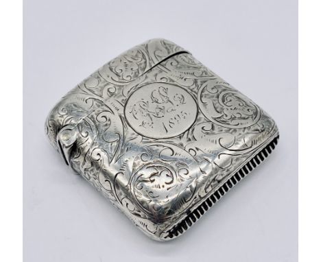 A hallmarked silver vesta case inscribed "RL 1895"