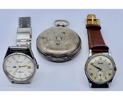 A silver full hunter pocket watch along with an Everite stainless steel wristwatch and one other by Carvel