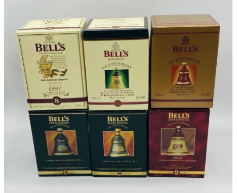 A collection of six boxed limited-edition Bell's Extra Special Old Scotch Whisky Christmas decanters dating from 1994 to 1999