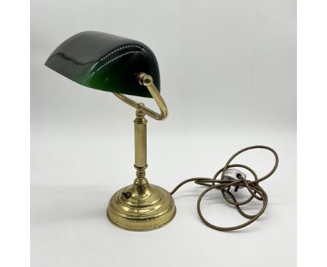 A brass banker's lamp with green glass shade 
