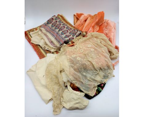 A collection of assorted vintage clothing to include dressing gown, Turkish coat, Victorian lace blouse etc.