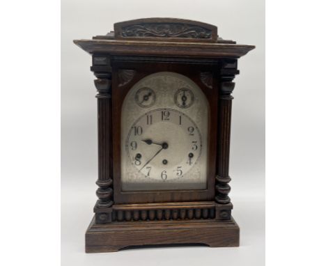 A vintage oak cased German chiming bracket clock height 43cm, depth 21. width 31