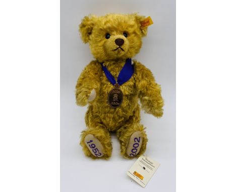 An unboxed Steiff "Golden Jubilee (1952-2002)" golden mohair teddy bear with purple ribbon, medallion & original label - heig