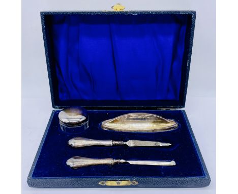 A cased hallmarked silver manicure set
