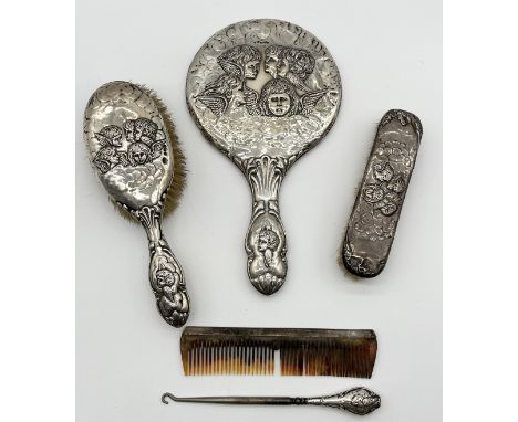 A hallmarked silver dressing table set consisting of mirror, brushes and a comb etc.