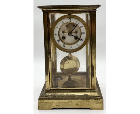 A French gilt brass cased mantel clock with enamelled dial and key