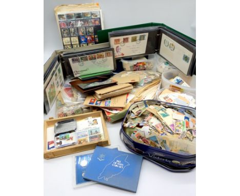 A large quantity of assorted stamps, first day covers, commemorative coins etc.