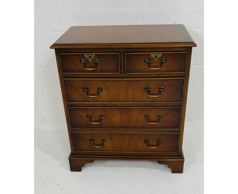 A Georgian style mahogany chest of two short and three long graduated drawers, on bracket feet, some ring marks to the top, 6