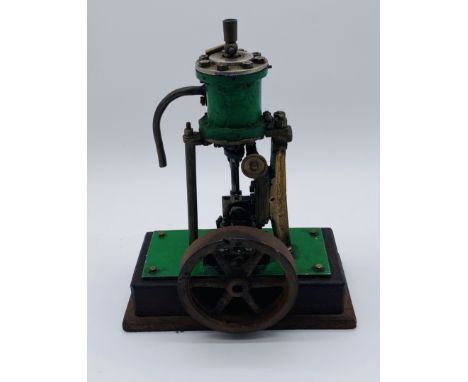 An unnamed vintage vertical live steam engine on wooden plinth - height 24cm