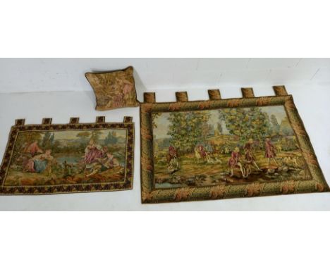 A large tapestry wall hanging of a classical garden scene 75cm x 130cm, another similar but smaller 50cm x 100cm, and a tapes