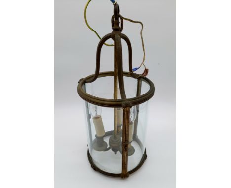 A vintage brass circular hall lantern.