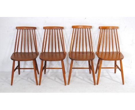 A set of four Ercol style stick-back chairs