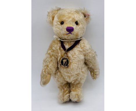 An unboxed limited-edition Steiff "Diamond Jubilee (1952-2012)" teddy bear with purple ribbon, medallion and original label -