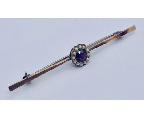 A 9ct gold brooch set with an amethyst and seed pearls, total weight 2.4g
