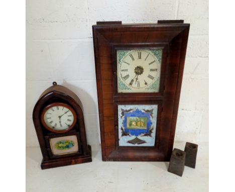 An American wall clock with weights, and a mantle clock.
