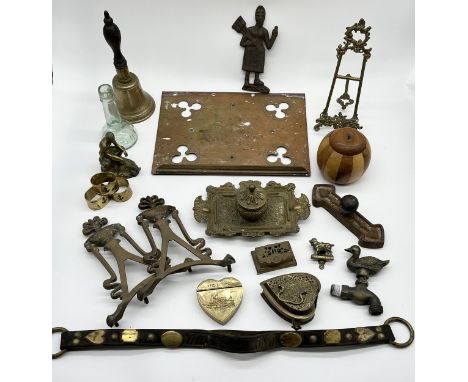 A collection of various items including brass easel, bell, bookrest, cast iron door handle, Art Nouveau inkwell etc.