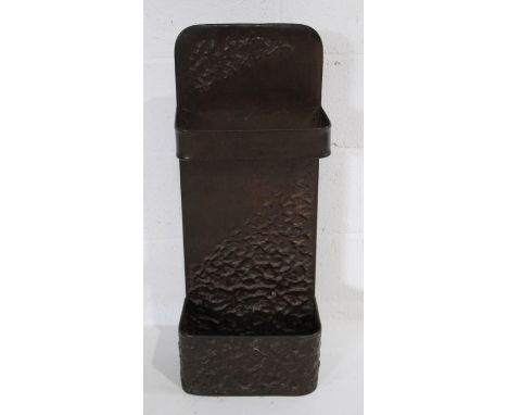 An Arts & Crafts copper stick stand, with repousse decoration