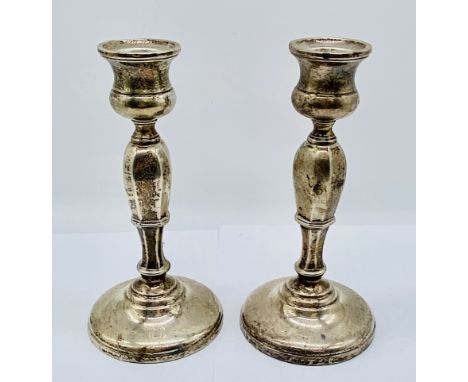 A pair of hallmarked silver candlesticks, height 15cm