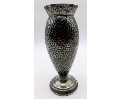 A silver-plated baluster shaped vase with hammered body decoration - 25cm high.