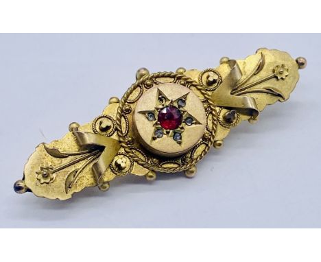A Victorian 9ct gold brooch set with ruby and diamonds, weight 3.5g