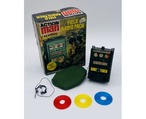 A vintage boxed Palitoy Action Man Field Radio, comprising of a radio, radio cover, head set and three interchangeable discs