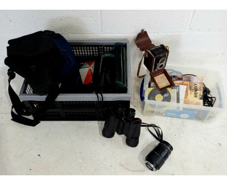 A collection of assorted cameras, cases, video camera etc. in two boxes