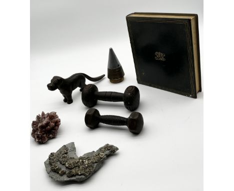 A collection of various items including artillery fuse, dog nutcracker, playing cards in leather book case, geological specim