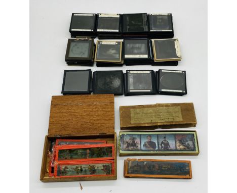 A collection of vintage magic lantern slides including mythical scenes, Disney, Mickey Mouse, The Transvaal war, zoo scenes, 