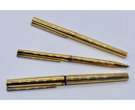 A DuPont de Paris silver-gilt fountain and ballpoint pen set, the fountain pen with an 18k nib