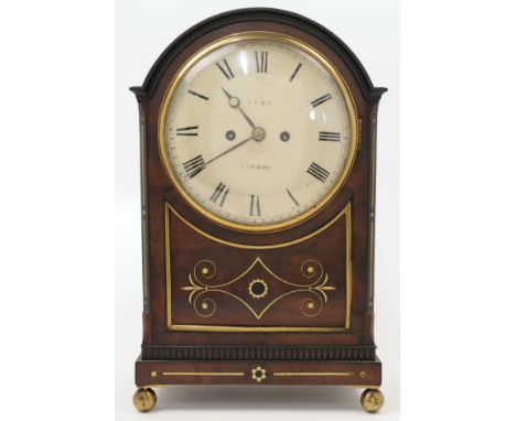 A brass mounted mahogany eight day bracket clock, second quarter 19th century, the arched moulded cornice above brass fish sc