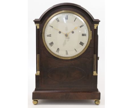 A mahogany eight day bracket clock, early 19th century, the break arch moulded cornice above stop fluted pilasters with brass