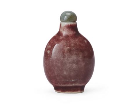 A Chinese red-glazed snuff bottle, Republic period, apocryphal four-character Qianlong mark, the flattened bottle of ovoid fo