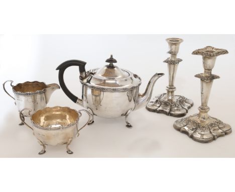 A silver three-piece tea set, Sheffield, 1931-32, Roberts & Dore Ltd., with wavy rims, on pad feet, teapot - 24.5cm wide; tog