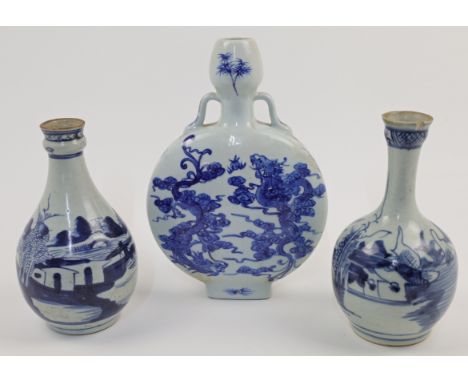 Three Chinese blue and white vases, 19th / 20th century, comprising: two export 'landscape' bottles, and a 'dragons' Ming-sty