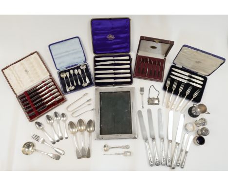 A group of silver, to include: including five coffee spoons with nephrite handles, stamped STERLING SILVER, with a New Zealan